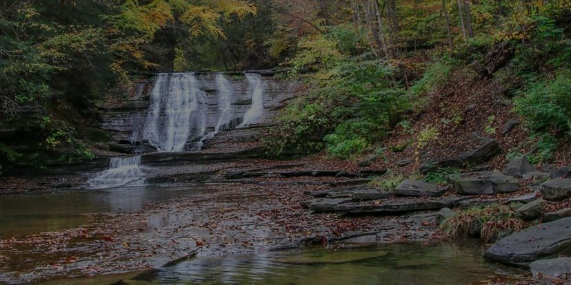 Spring Returns to the Glen at Sugar Creek Glen Campground Spring waterfalls and forest scenery at Sugar Creek Glen Campground in the Finger Lakes region of New York